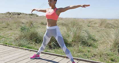 Sporty athletic woman stretching a leg
