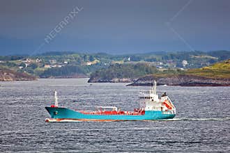 Freight ship running along coast, Norway - Scandinavia