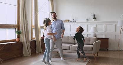Energetic small kids siblings having fun with father.
