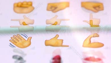 Macro finger browsing emojis on a virtual keyboard