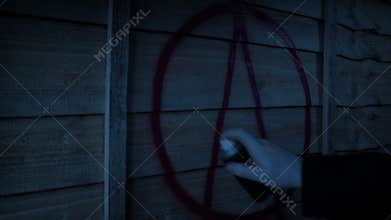 Man Sprays Anarchy Symbol On Fence In The Dark