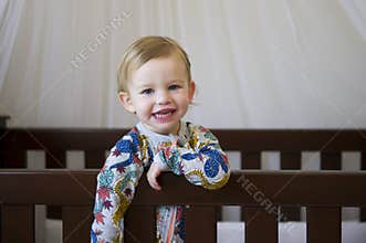 Cute toddler in cot
