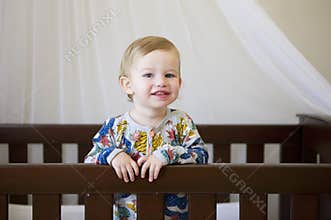 Cute toddler in cot
