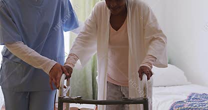 Nurse helping a senior woman in a retirement home