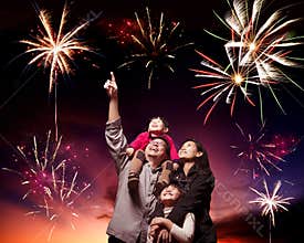 Happy family looking fireworks