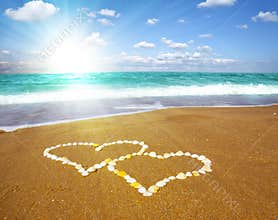 Connected hearts on beach - love concept