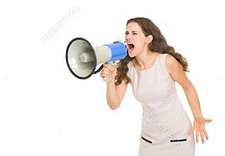 Angry young woman shouting thought megaphone