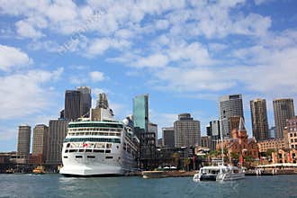Harbor city with docked cruise ship in Sydney skyline