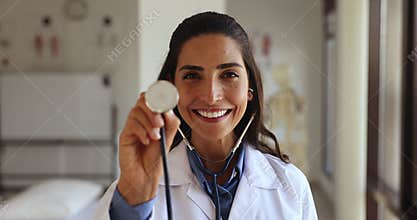Latina female cardiologist posing at workplace with stethoscope