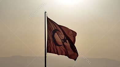 Aerial view of waving turkish flag in reverse light