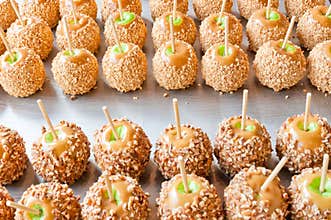 Batch of caramel apples with nuts
