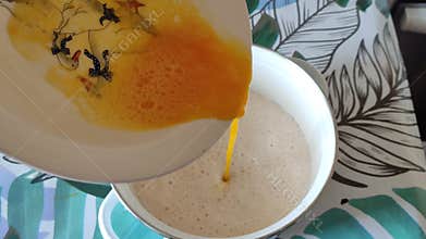 Adding a beaten egg to the dough