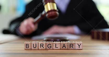 Text burglary and judge banging gavel in court