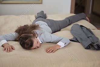 Business woman fall down from exhaustion in room