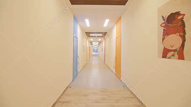 Yellow corridor with classrooms doors in children center