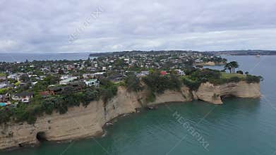 Aerial view of the rocky shore of Arkles Bay, North Island, New Zealand