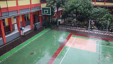 Wet basketball court due to heavy rain