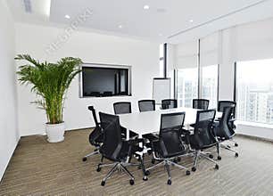 Modern Meeting Room with White Table and City View