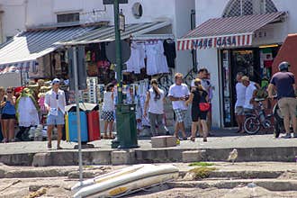 Crowd on the street near stores in summertime at Capri Island, Naples, Italy