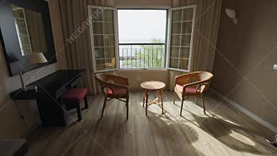 Beds, table and two chairs in classic hotel room. Cozy place to relax. Camera moves over empty room in resort hotel