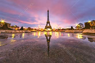 Early morning Eiffel tower reflection on the empty Trocadéro fountain under Paris red golden color morning sky