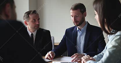 Entrepreneurs negotiating, discuss contract terms, planning future cooperation