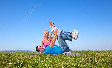Happy family on picnic in park