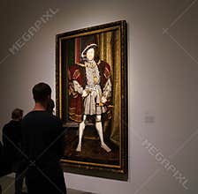Visitors to the Met`s Tudor Gallery admire a full length portrait of King Henry VIII