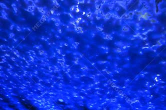 Abstract Blue Soap Foam on Glass Surface