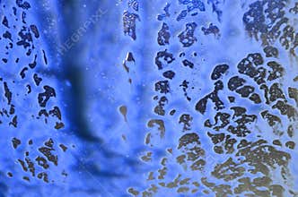 Abstract Blue Soap Foam on Glass Surface