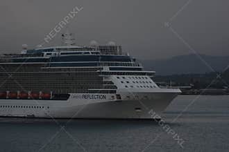 Celebrity Reflection Cruise Ship Sailing Under Cloudy Sky