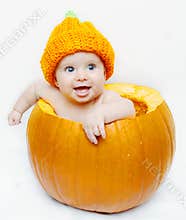 Happy baby in a pumpkin