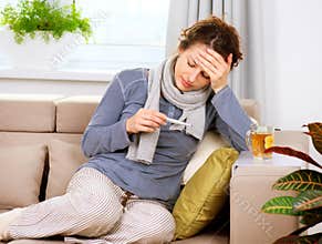 Sick Woman with Thermometer