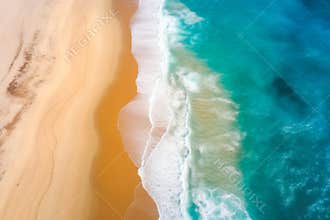 Aerial view to tropical sandy beach and blue ocean. Top view of ocean waves reaching shore on sunny day.