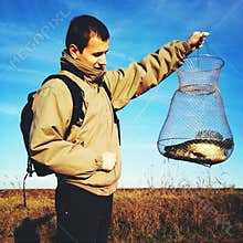 Proud fisherman with catch