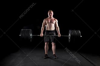 Strong man deadlifts a lot of weight
