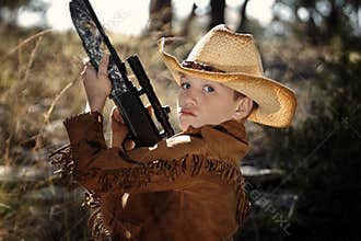 Child in cowboy outfit