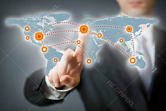 Businessman pointing at a spot on a world map