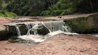 A waterfall over an ex road crossing in a nature reserve