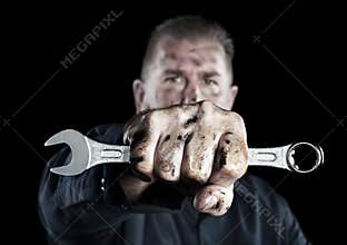 Mechanic holding wrench