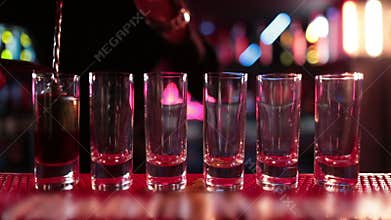 Ready-made drinks are on the bar ready to be consumed.