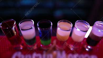 Ready-made drinks are on the bar ready to be consumed.