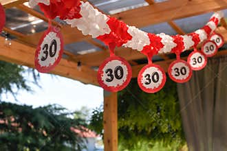 some balloons with red, white and black numbers on them