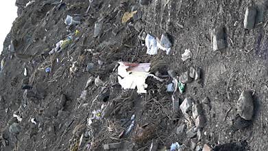 Vertical shot of waste in a dumping ground.
