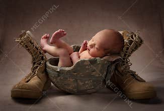 Newborn in Military Helmet