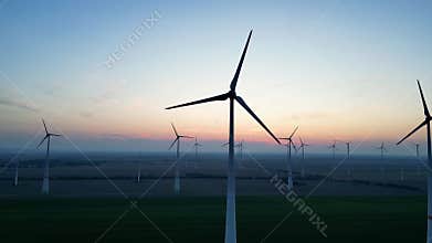 Areal view of windmills in rural area after sunset, blue hour