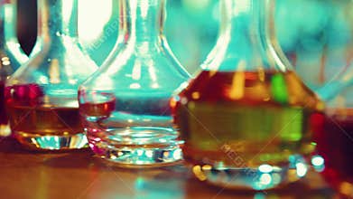 Diversity of taste. Bottles with different with liqueurs, alcohol drinks standing on bar table. Degustation