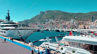 Monaco, Monte-Carlo, 29 September 2022: Invited wealthy clients inspect megayachts at the largest fair exhibition in the