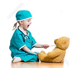 Child dressed as doctor playing with toy