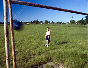 Boy kicking ball